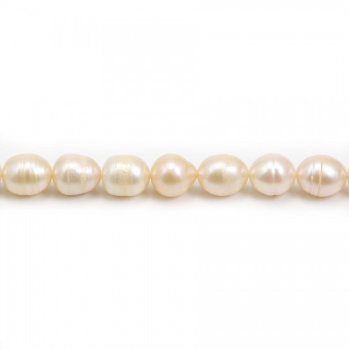 Salmon color oval freshwater pearls on thread 10x12mm x 40cm