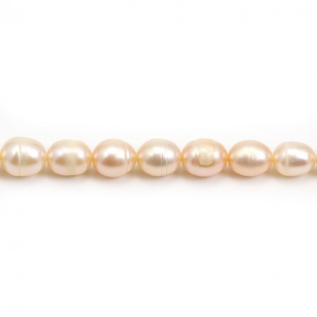 Salmon color oval freshwater pearls on thread 7-10mm x 40cm