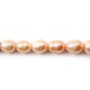 Salmon color oval freshwater pearls on thread 6-6.5mm x 40cm