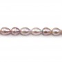 Salmon color oval freshwater pearls on thread 9-10mm x 40cm