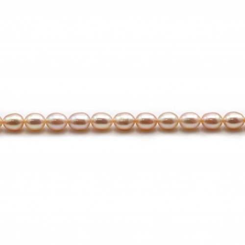 Salmon color oval freshwater pearls on thread6-7mm x 40cm