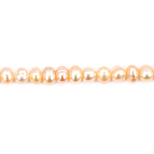 Salmon color oval freshwater pearls on thread 4mm x 40cm